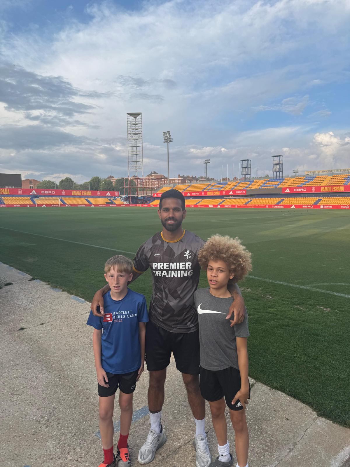 Coach Rishi with players at stadium